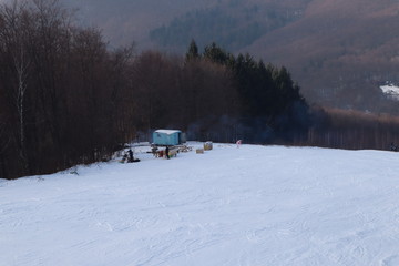 people enjoy outdoor activities in the mountains, skiing and snowboarding