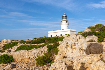 Fototapeta na wymiar Cavalleria lighthouse situated at the northernmost point of Menorca island. Baleares, Spain