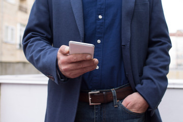 man with mobile phone in the city