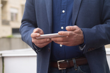 man using mobile phone close-up view