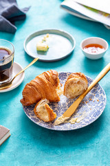 Breakfast with croissant and black coffee