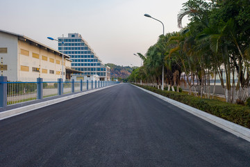 An asphalt road leads to the distance