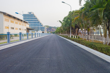 Fototapeta premium An asphalt road leads to the distance