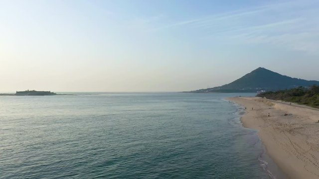 Fly over along Moledo Beach, looking over Santa Tecla hill and &iacute;nsua island