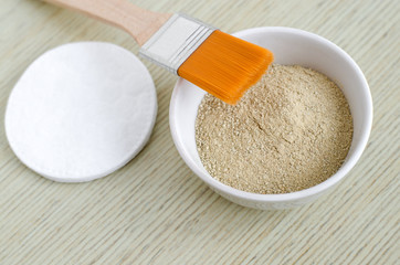 Kaolin clay powder in a small bowl. Homemade beauty treatment recipe.