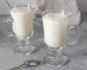 Fresh blended  kiwi protein smoothie with yogurt or milk in glass jar, healthy eating