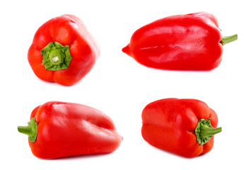 Set of fresh raw red peppers on isolated background