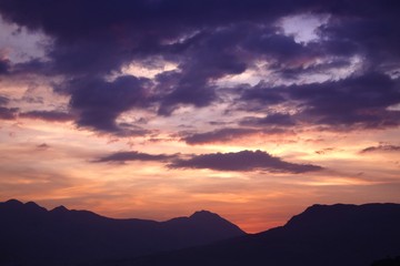 Silhouetted mountains and a brilliant sunset