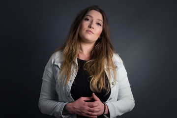 Business Concept - Portrait Handsome Business woman holding hands with confident face isolated over gray Background.