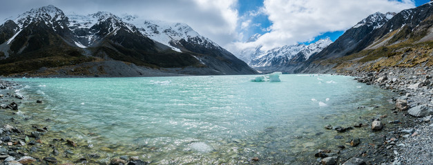 Glacier lake with icebergs and snowy mountains New Zealand