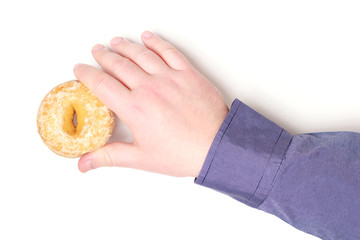 Hand takes gingerbread donut