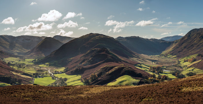 Majestic Autumn Fall landscape image of Sleet Fell and Howstead Brow in Lake District with beautiful early morning light in valleys and on hills