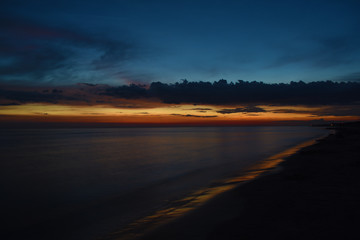 Fototapeta na wymiar Beautiful sunset over calm sea Liepaja Latvia