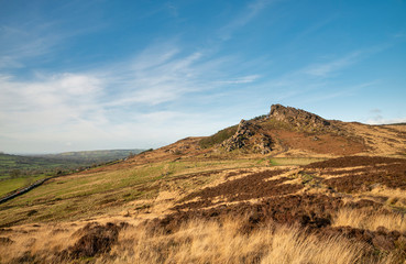Epic Peak District Winter landscape of Ramsaw Rocks viewed from Hen Cloud with beautiful sunset sky