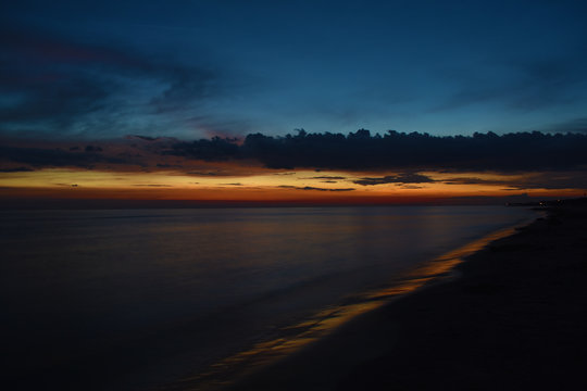 Beautiful sunset over calm sea Liepaja Latvia