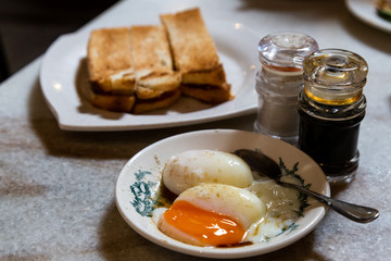 Half boiled eggs and toast bread, popular Chinese style breakfast in Malaysia