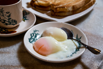 Half boiled eggs, coffee, toast bread, popular Chinese style breakfast in Malaysia
