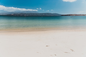 landscape in Opossum Bay Beach on a sunny summer day with nobody on the beach with deep blue water...