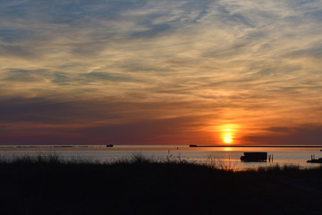 Beautiful orange sunset sky reflection on calm sea