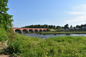 Fototapeta na wymiar The Old Brick Bridge across the Venta river. Kuldiga, Latvia