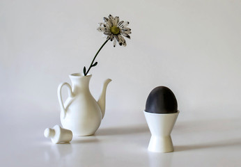 still life with egg and chamomile