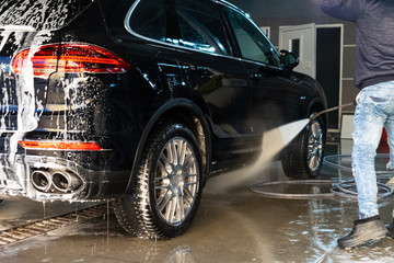 man cleaning car carwash