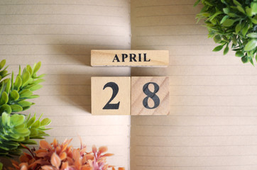 April 28, Appointment date with number cube design for background.