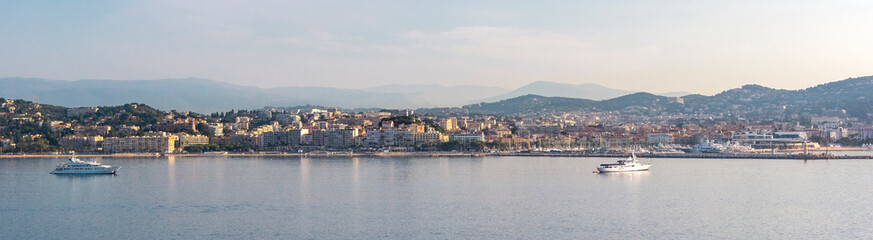Fototapeta na wymiar Panoramic view, aerial skyline of city Cannes, Mediterranean Sea with yachts, coastline, port morning at dawn in Cannes, Cote d'Azur, France