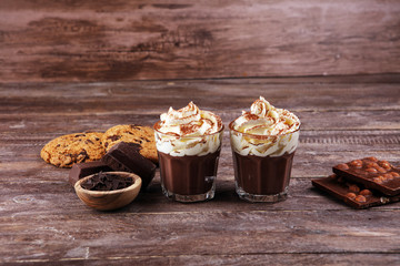 hot chocolate with cocoa and chocolate chip cookies and whipped cream