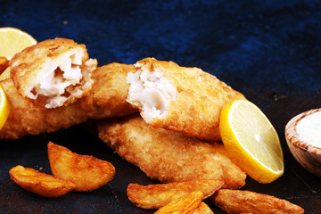 traditional British fish and chips consisting of fried fish, potato chips and mayonnaise