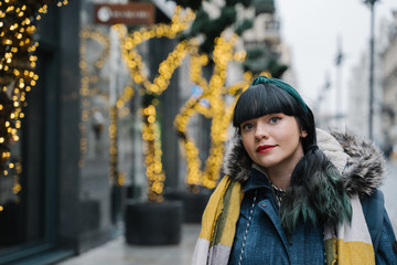Portrait of stylish woman in the street