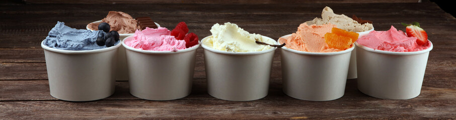 Various of ice cream flavor with fresh blueberry, strawberry, almond, chocolate, vanilla setup on rustic background . Summer and Sweet cold ice cream