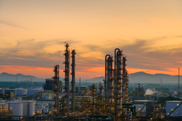 Oil and gas refinery plant or petrochemical industry on sky sunset background, Factory with...