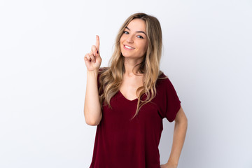 Young woman over isolated white background showing and lifting a finger in sign of the best