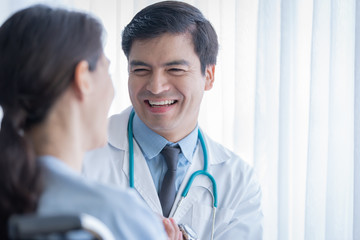 A doctor take care of sick patient woman at the hospital or medical clinic.