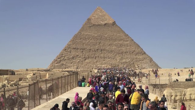 The Pyramid of Khafre or Chephren. Tourists visit Egyptian Pyramides at the Giza Plateau in Cairo, Egypt. 