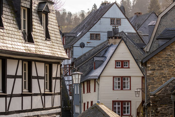 Fototapeta na wymiar City view of Monschau with house facades in different materials