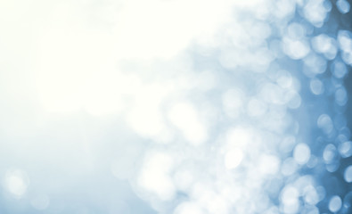 Light Blue Background Blurred leaves, circular bokeh, abstract from beautiful leaves, green nature concepts and for design images and computer screens.