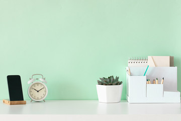 School desktop in modern style with Blank space. Modern home interior design on green background.
