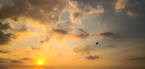 Naklejka na ściany i meble Sky Diving with Beautiful sunset. Kata beach. Phuket, Thailand.