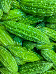 Vertical full frame photo of bitter melons at groceries market