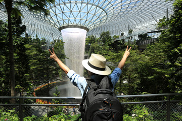 Travel lifestyle vacations concept, Asian girl traveler with backpack enjoying and hand making...