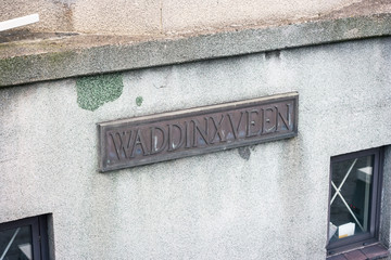 Name sign of Waddinxveen at the lifting bridge over canal Gouwe, Netherlands