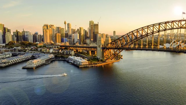 4k time lapse hyperlapse or drone lapse at Sydney city harbour during sunrise. Tilt up