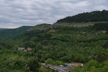 Fototapeta na wymiar Panoramic view of Yantra river canyon from Trapezitsa fortress. Veliko Tarnovo, Bulgaria