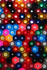 Light shining through brightly coloured plastic circles
