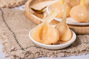 Fototapeta na wymiar Garlic pickled with vinegar and sugar is very popular in South Korea and Asia