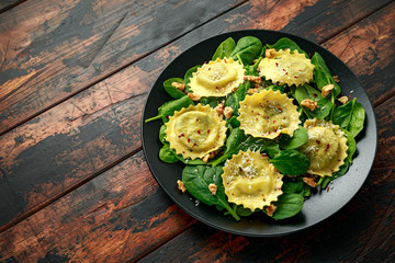 Italian ravioli pasta stuffed with spinach, creamy ricotta cheese, walnuts. Healthy Vegetarian food
