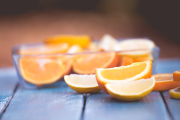 Fototapeta na wymiar citrus fruits orange and lemons on blue background