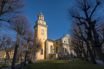 Fototapeta na wymiar The yellow church Maria kyrka in the district Södermalm of Stockholm a sunny winter day